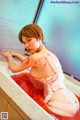 A woman in a bathtub covered in blood.